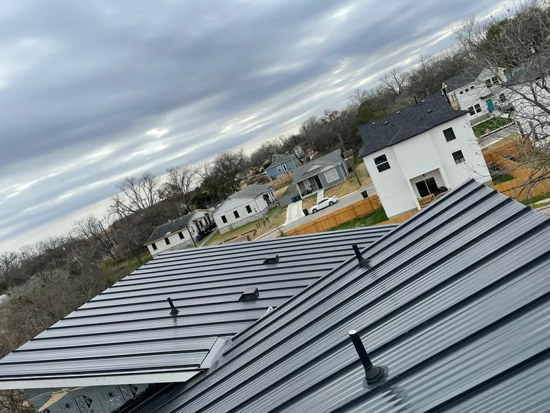 Standing seam metal roof panels with vents for Skylight Repair in Brookline